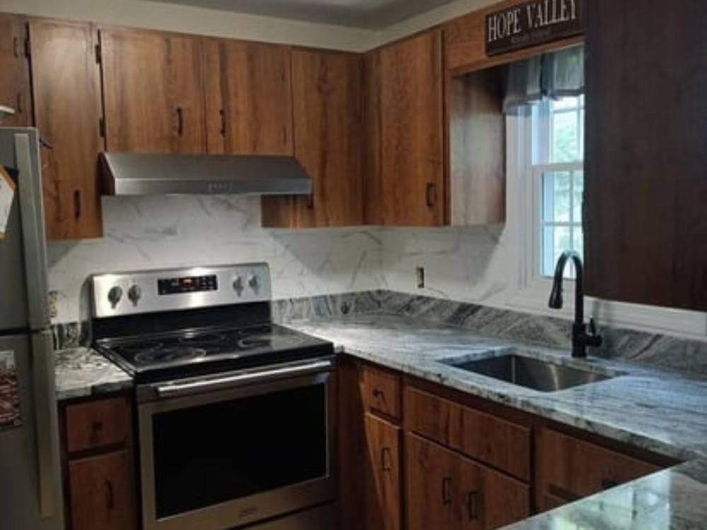 Silver Cloud Granite Kitchen – completed countertops and tile backsplash